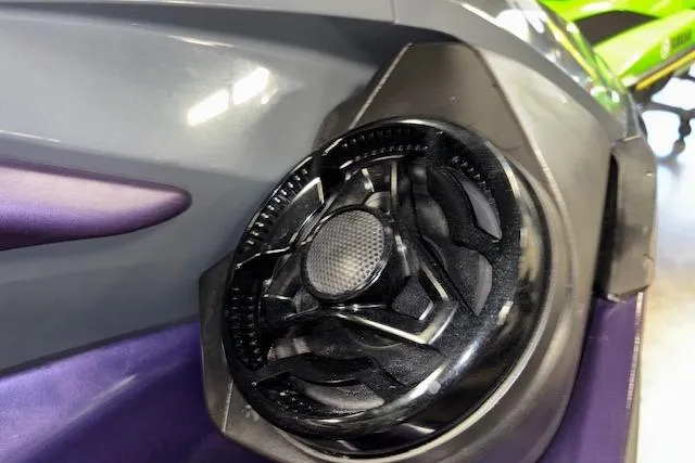 Slide: The Image of 2021 Sea-Doo RXT-X 300 speaker detail, featuring sleek black and purple design. - 9