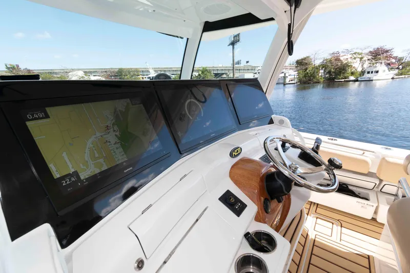 Slide: The Image of Helm of 2021 HCB 53 Sueños boat with navigation screens and steering wheel. - 10