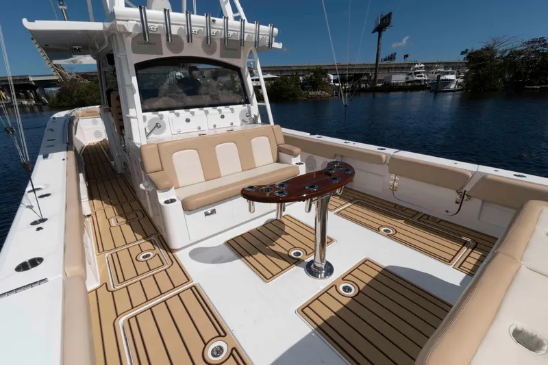 Slide: The Image of 2021 HCB 53 Sueños boat with luxurious seating and sleek deck design. - 15