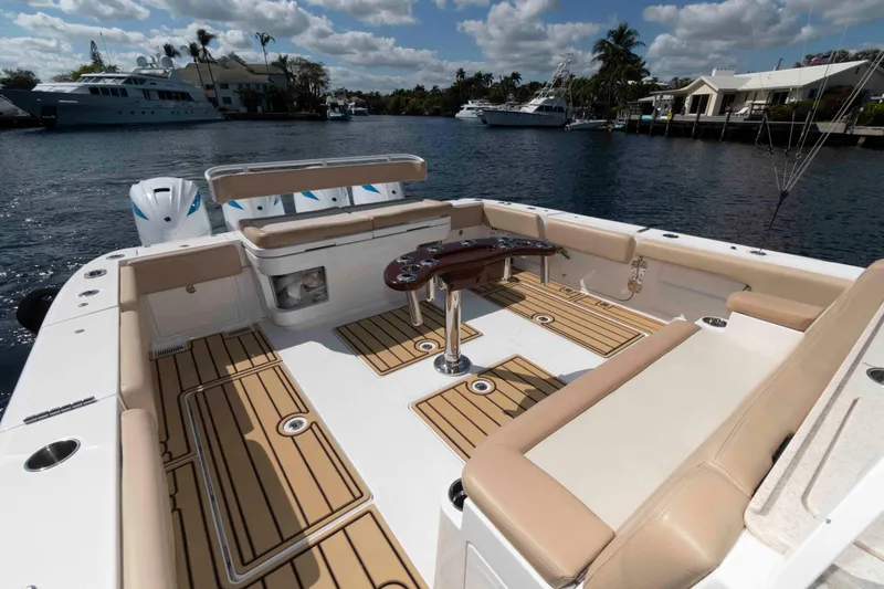 Slide: The Image of 2021 HCB 53 Sueños boat with spacious deck and luxurious seating. - 16
