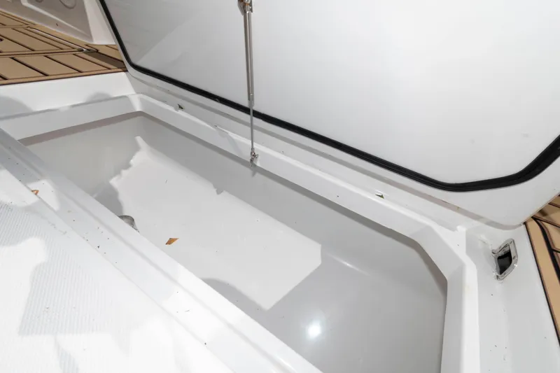 Slide: The Image of 2021 HCB 53 Sueños cabin interior with twin beds and wooden cabinets. - 32