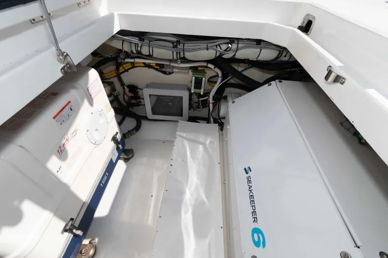 Slide: The Image of 2021 HCB 53 Sueños boat with open storage compartments on deck. - 34