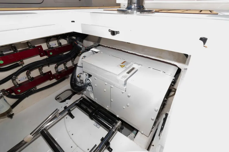 Slide: The Image of Engine compartment of 2021 HCB 53 Sueños boat, showcasing mechanical components and wiring. - 39