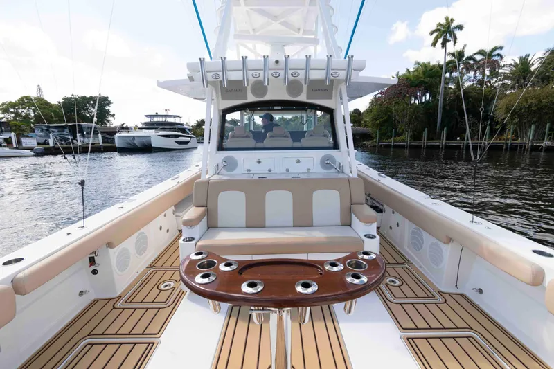 Slide: The Image of 2021 HCB 53 Sueños luxury boat interior with seating and fishing rod holders. - 5