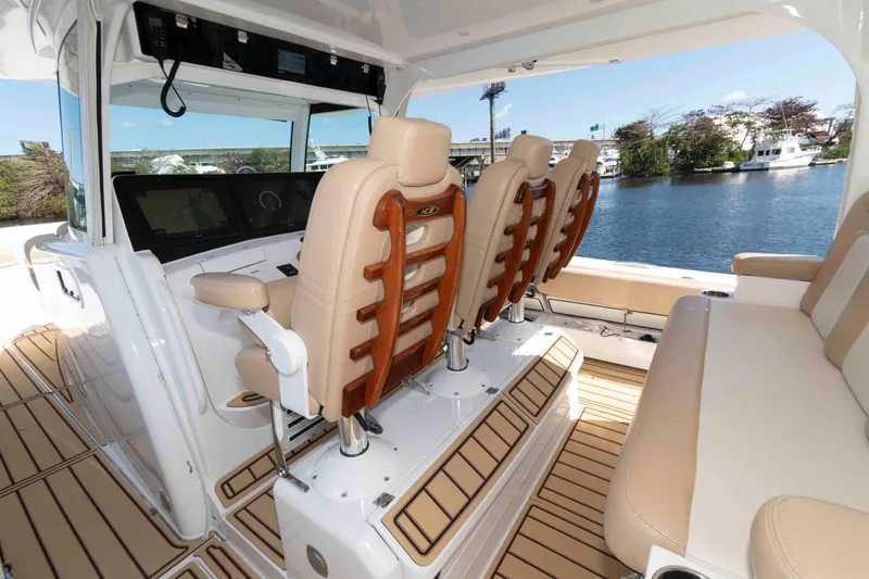 Slide: The Image of Interior of 2021 HCB 53 Sueños boat with luxurious seating and helm. - 9