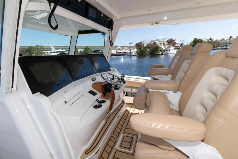 Slide: The Image of Interior of 2021 HCB 53 Sueños boat with luxurious seating and advanced navigation system. - 13