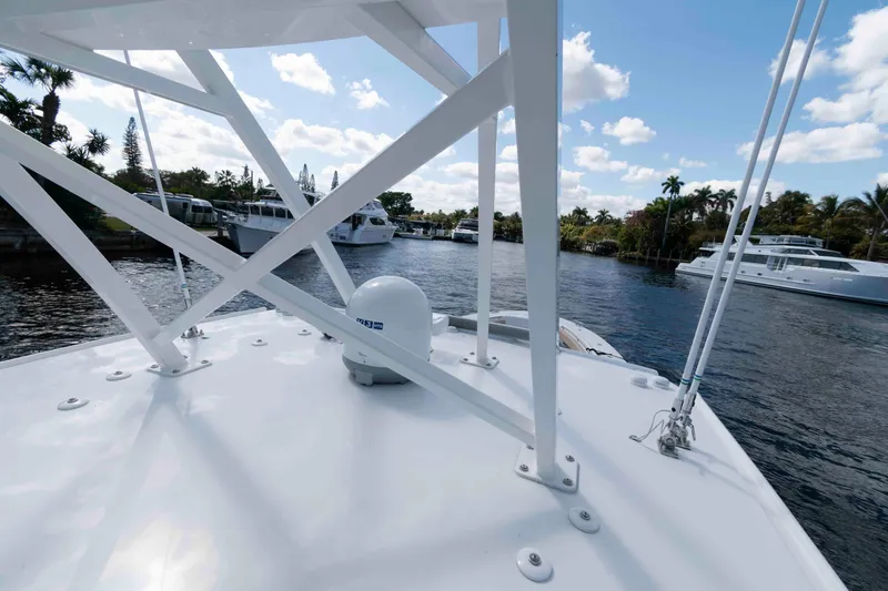 Slide: The Image of 2021 HCB 53 Sueños boat on a scenic waterway with clear skies. - 28