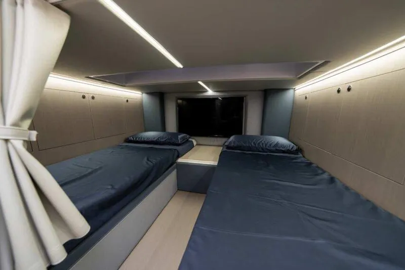 Slide: The Image of Interior cabin of 2026 Ranieri CAYMAN 50.0 HARD TOP with twin beds and modern lighting. - 11