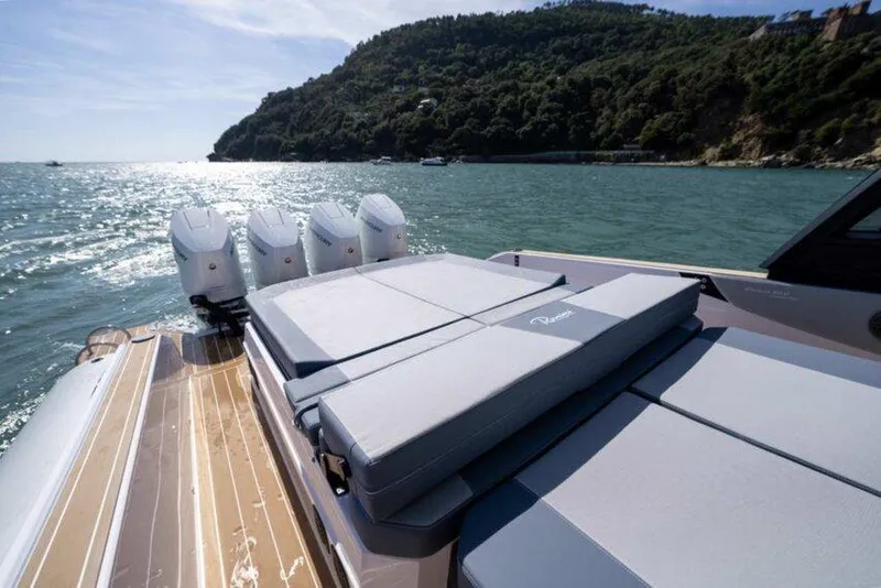 Slide: The Image of Luxury Ranieri CAYMAN 50.0 HARD TOP yacht, 2026 model, cruising on scenic waters. - 13