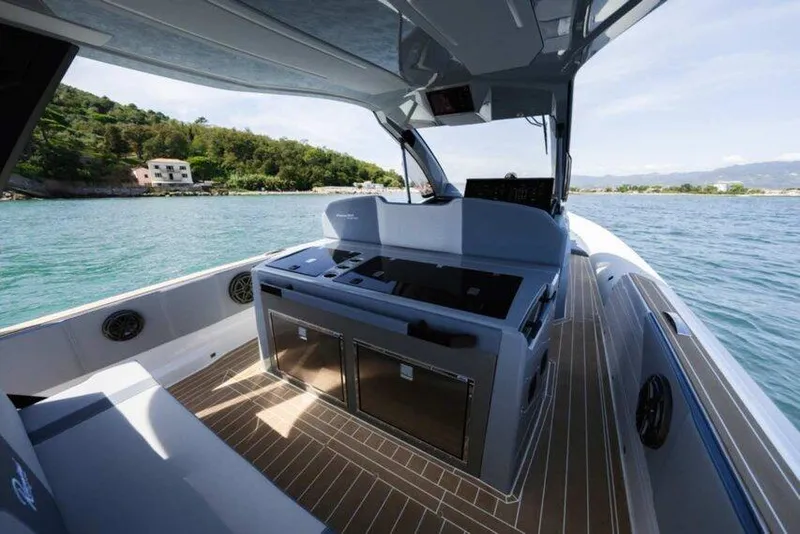 Slide: The Image of 2026 Ranieri CAYMAN 50.0 HARD TOP boat interior with sleek design and modern amenities. - 17