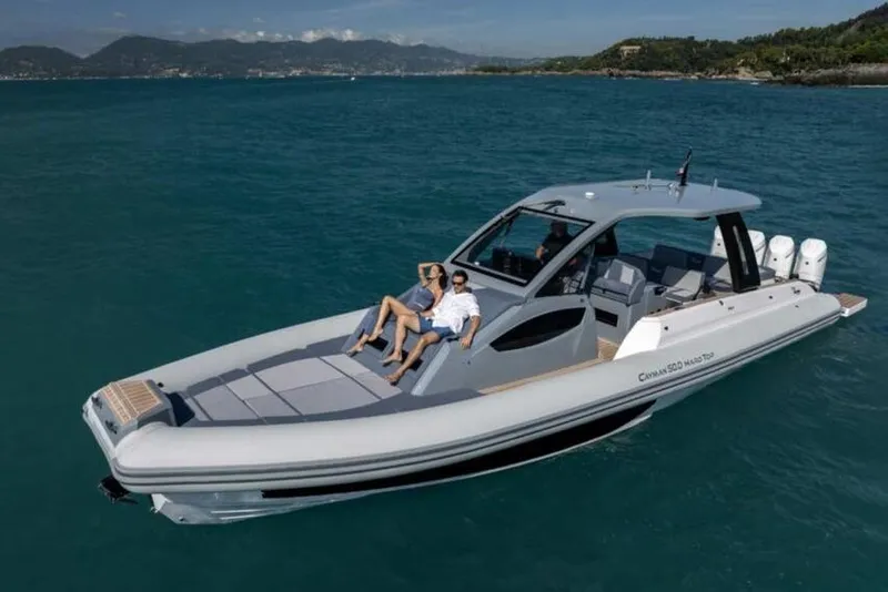 Slide: The Image of Luxury 2026 Ranieri CAYMAN 50.0 HARD TOP yacht cruising on open water. - 2