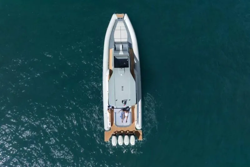 Slide: The Image of Aerial view of 2026 Ranieri CAYMAN 50.0 HARD TOP yacht on blue water. - 26