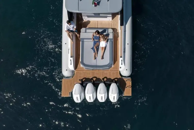 Slide: The Image of Aerial view of 2026 Ranieri CAYMAN 50.0 HARD TOP with people relaxing onboard. - 27