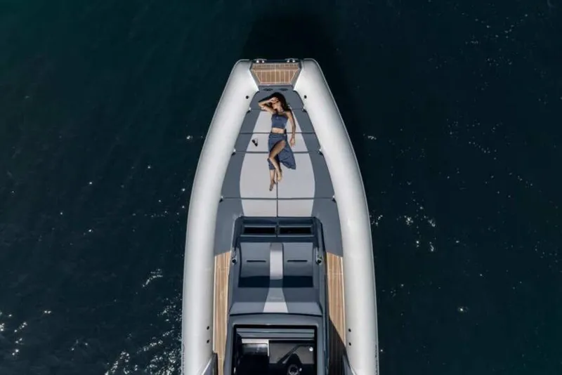 Slide: The Image of 2026 Ranieri CAYMAN 50.0 HARD TOP yacht with person sunbathing on deck, aerial view. - 4