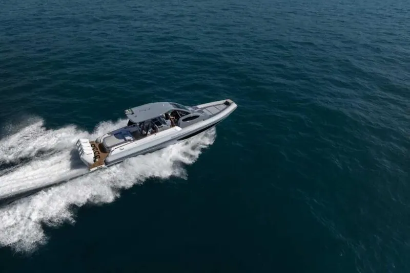 Slide: The Image of 2026 Ranieri CAYMAN 50.0 HARD TOP cruising on open sea, aerial view. - 5