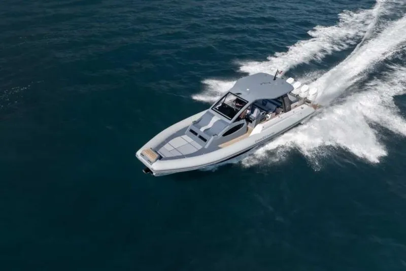 Slide: The Image of 2026 Ranieri CAYMAN 50.0 HARD TOP cruising on open water, aerial view. - 6