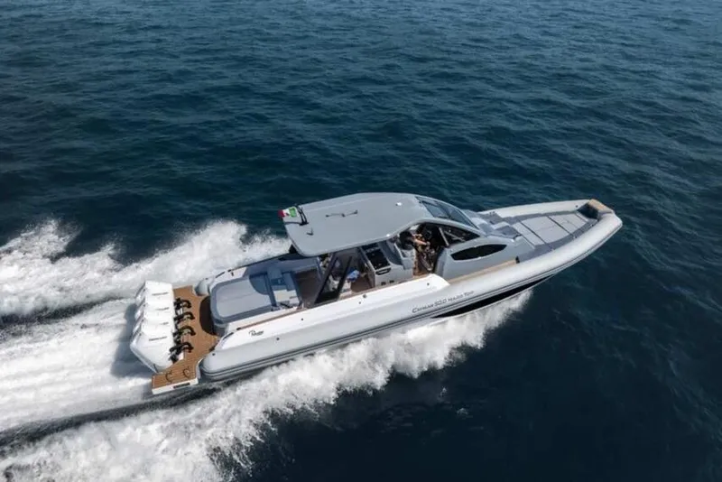 Slide: The Image of 2026 Ranieri CAYMAN 50.0 HARD TOP cruising on open sea, showcasing sleek design and powerful engines. - 7