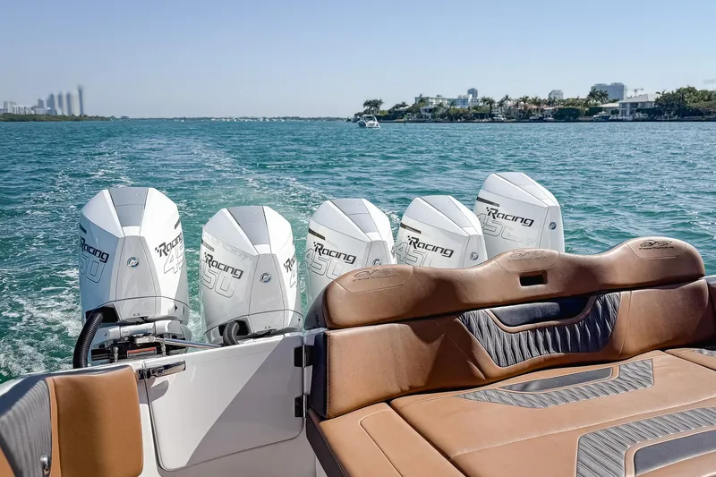 Slide: The Image of 2022 MTI V50 boat with five powerful outboard engines on a sunny day. - 14