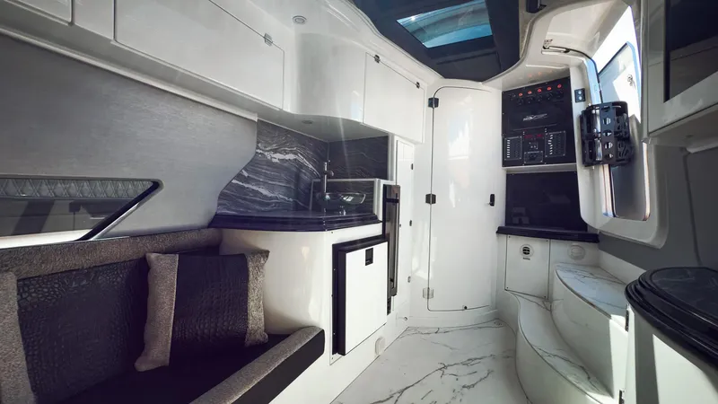 Slide: The Image of Luxurious interior of 2022 MTI V50 yacht with modern kitchen and seating area. - 20