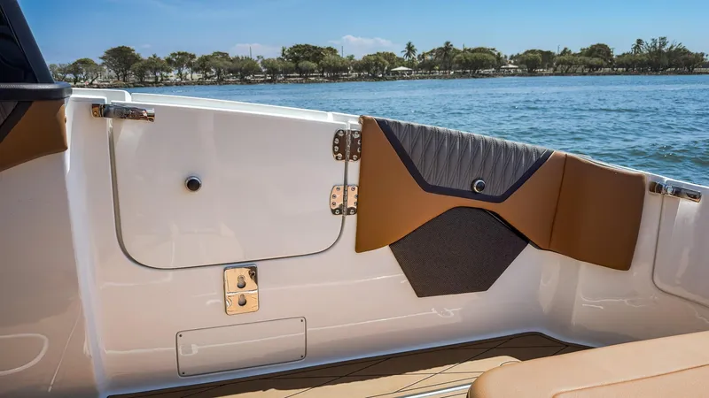 Slide: The Image of Interior view of 2022 MTI V50 boat, featuring sleek design and water in the background. - 24