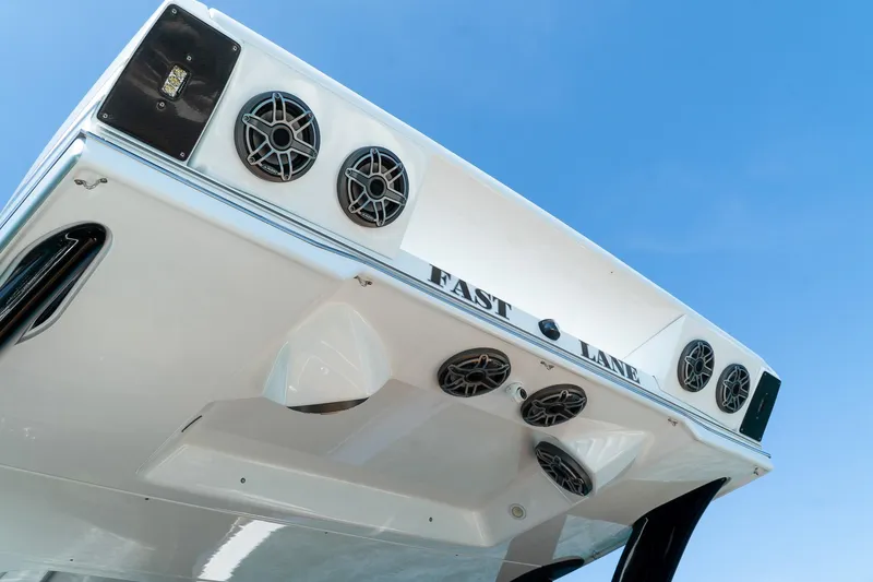 Slide: The Image of MTI V50 2022 boat with speakers and "Fast Lane" text against blue sky. - 26