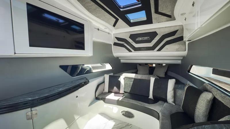 Slide: The Image of Luxurious interior of 2022 MTI V50 boat with modern seating and skylights. - 31
