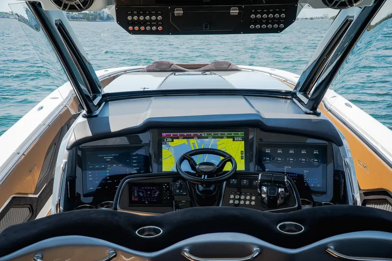 Slide: The Image of Cockpit of 2022 MTI V50 boat with advanced navigation system and steering wheel. - 48