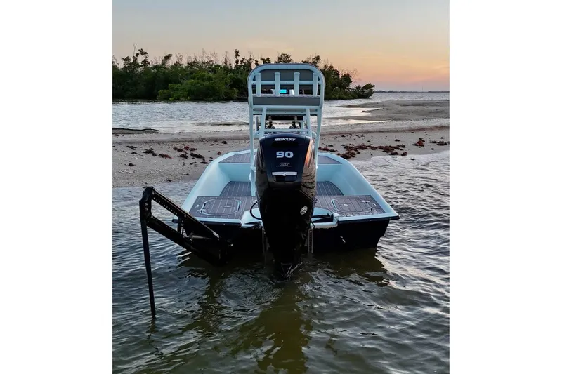 Slide: The Image of 2001 Pro Sports 16 boat with Mercury 90 engine at sunset near shoreline. - 3