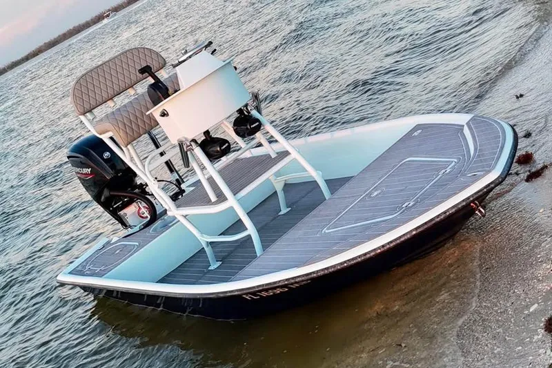 Slide: The Image of 2001 Pro Sports 16 boat with Mercury engine on sandy shore. - 9