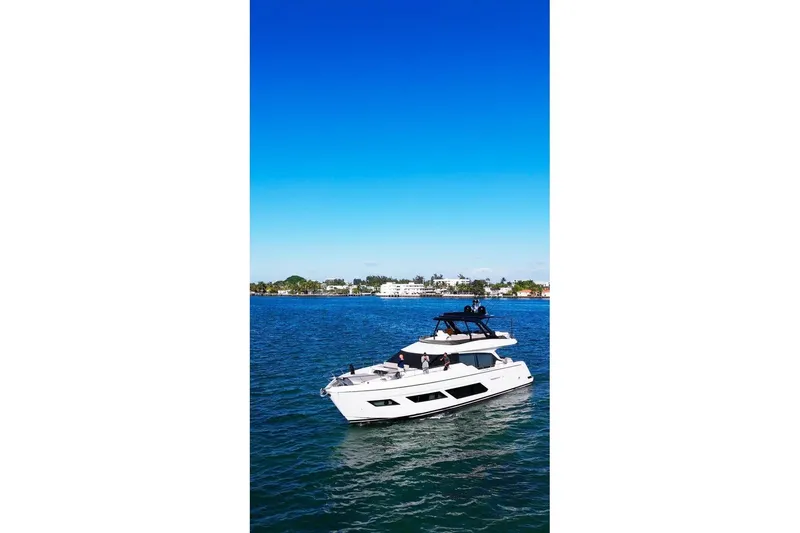 Slide: The Image of 2023 Ferretti Yachts 720 cruising on blue ocean under clear sky. - 4