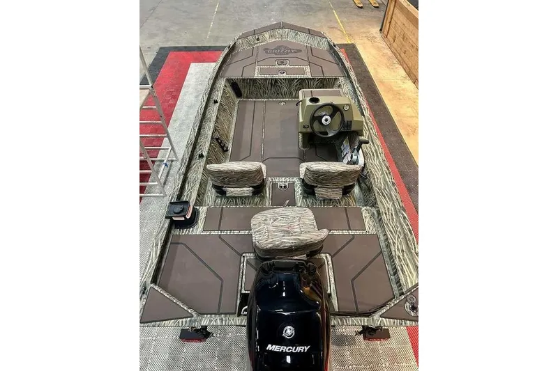 Slide: The Image of 2026 Tracker Grizzly 1754 SC boat with camo seats and Mercury outboard motor. - 11