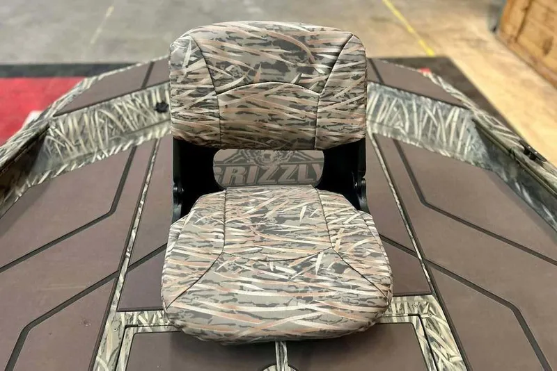 Slide: The Image of 2026 Tracker Grizzly 1754 SC boat seat with camouflage pattern. - 6