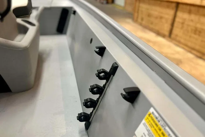 Slide: The Image of 2026 Tracker Bass Tracker Classic CC interior detail with rod holders and seating. - 16