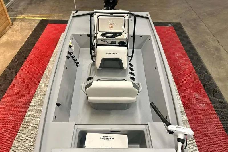 Slide: The Image of 2026 Tracker Bass Tracker Classic CC boat interior with steering console and seating. - 21