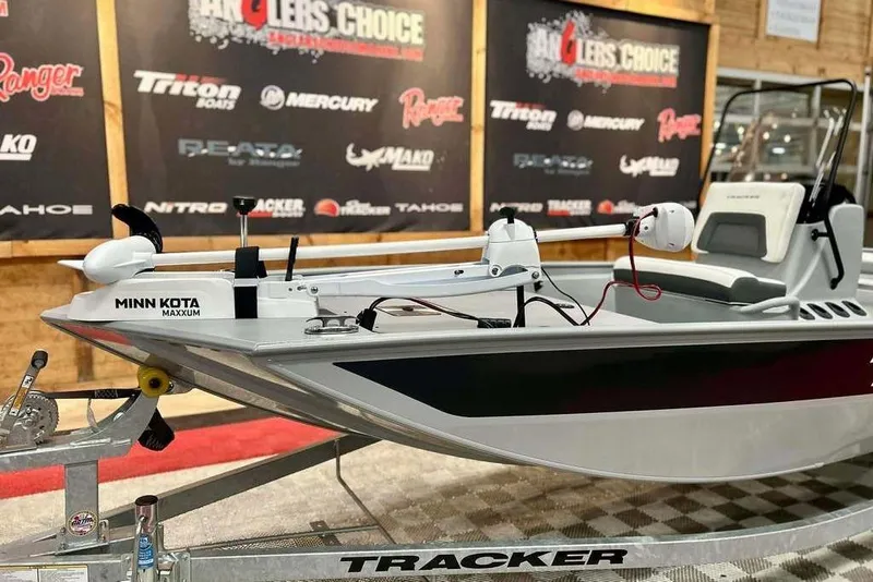 Slide: The Image of 2026 Tracker Bass Tracker Classic CC boat with Minn Kota Maxxum motor on display. - 8