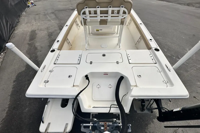 Slide: The Image of 2018 Key West 210 Bay Reef boat, white deck, storage compartments, and seating. - 11