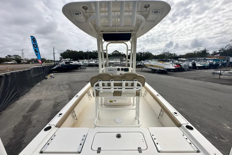 Slide: The Image of 2018 Key West 210 Bay Reef boat in a marina with overcast sky. - 12