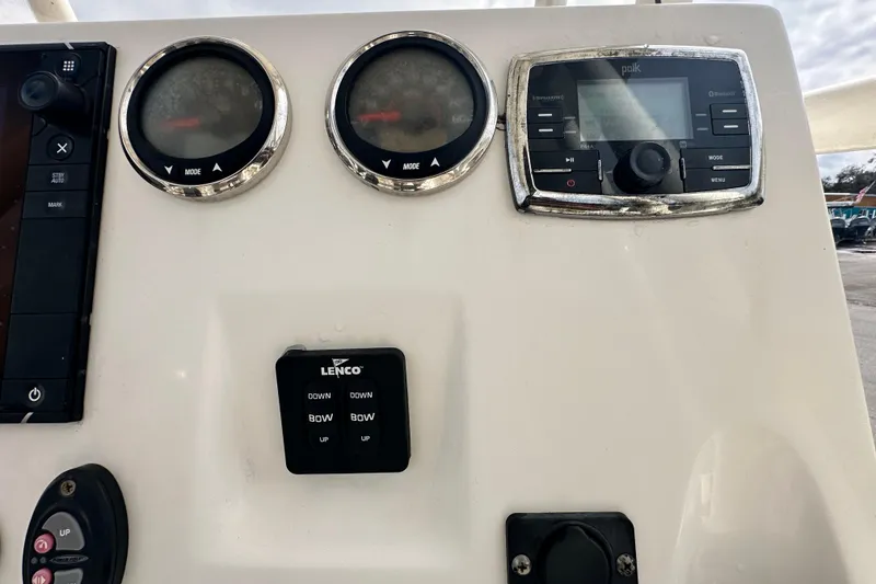 Slide: The Image of Control panel of a 2018 Key West 210 Bay Reef boat with gauges and stereo system. - 18
