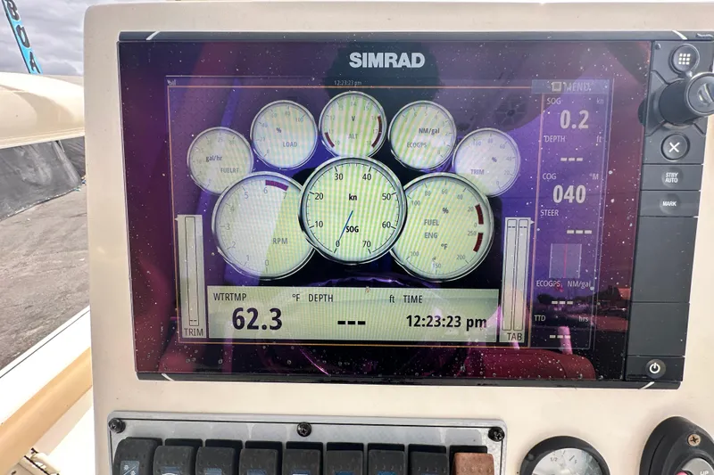 Slide: The Image of Simrad display on 2018 Key West 210 Bay Reef showing navigation and engine data. - 20