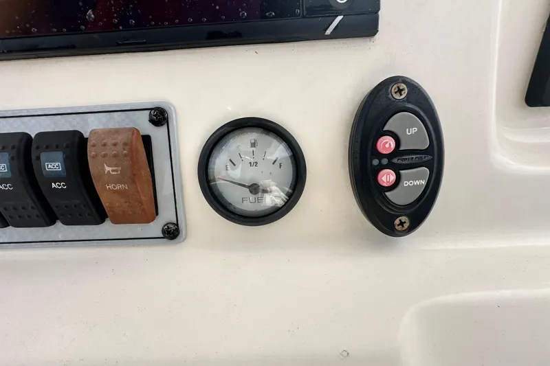 Slide: The Image of Control panel of 2018 Key West 210 Bay Reef boat with fuel gauge and switches. - 22