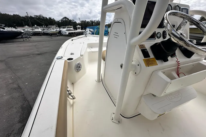 Slide: The Image of 2018 Key West 210 Bay Reef boat interior with steering console and seating. - 23