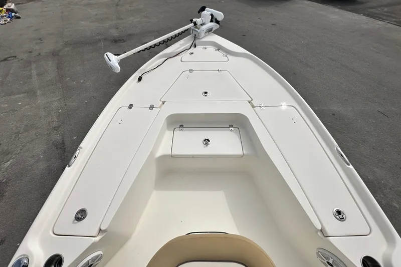 Slide: The Image of 2018 Key West 210 Bay Reef boat deck with storage compartments and trolling motor. - 27