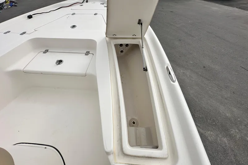 Slide: The Image of 2018 Key West 210 Bay Reef boat storage compartments open on deck. - 34
