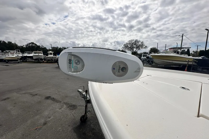 Slide: The Image of 2018 Key West 210 Bay Reef boat with iPilot trolling motor in a marina setting. - 40