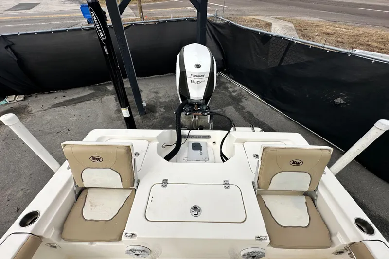 Slide: The Image of 2018 Key West 210 Bay Reef boat with Evinrude engine, docked and ready for use. - 46