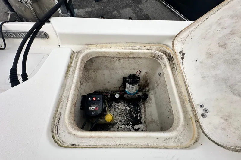 Slide: The Image of Open hatch of 2018 Key West 210 Bay Reef boat showing internal components. - 52
