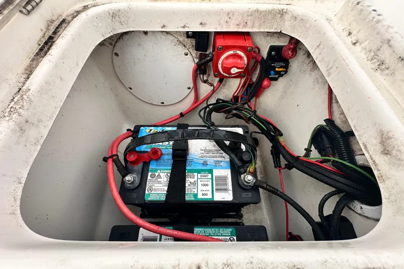 Slide: The Image of Battery compartment of 2018 Key West 210 Bay Reef boat with wiring and switch. - 53