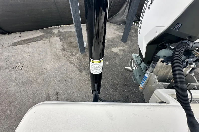 Slide: The Image of 2018 Key West 210 Bay Reef boat with Evinrude engine and caution label. - 55