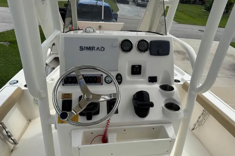 Slide: The Image of 2018 Key West 210 Bay Reef boat on trailer, outdoor display. - 7