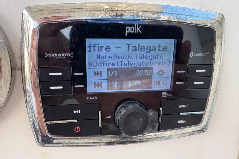 Slide: The Image of 2018 Key West 210 Bay Reef boat on trailer under cloudy sky. - 9